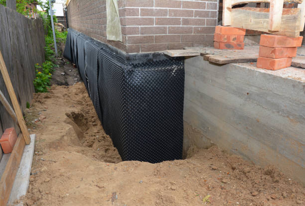 Happy homeowners after waterproofing job in Forest Park